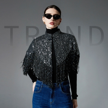 Black embroidered sequin shawl with fringe shown in a worn party styling view