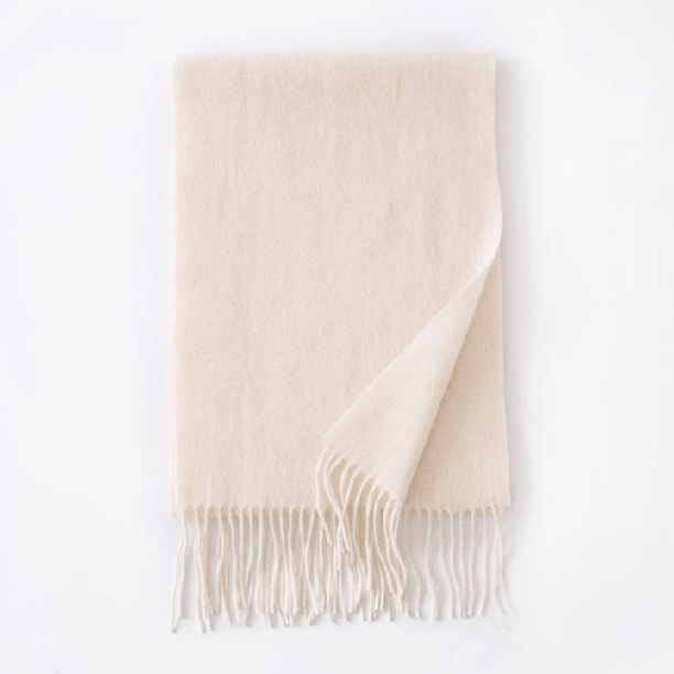 Stacked solid color wool scarves prepared for assortment inspection
